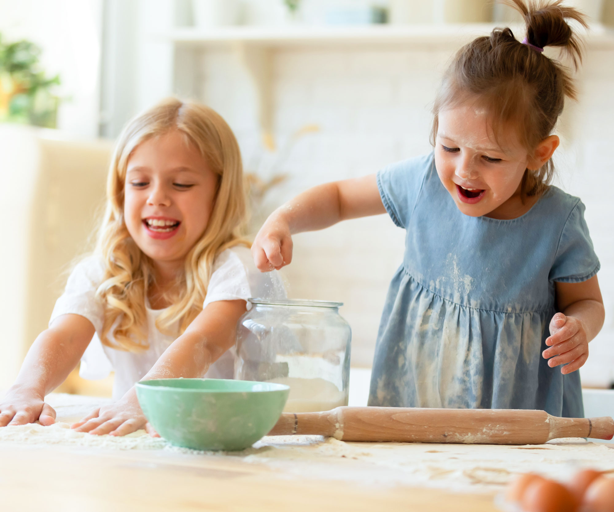 Children making food in a clean kitchen