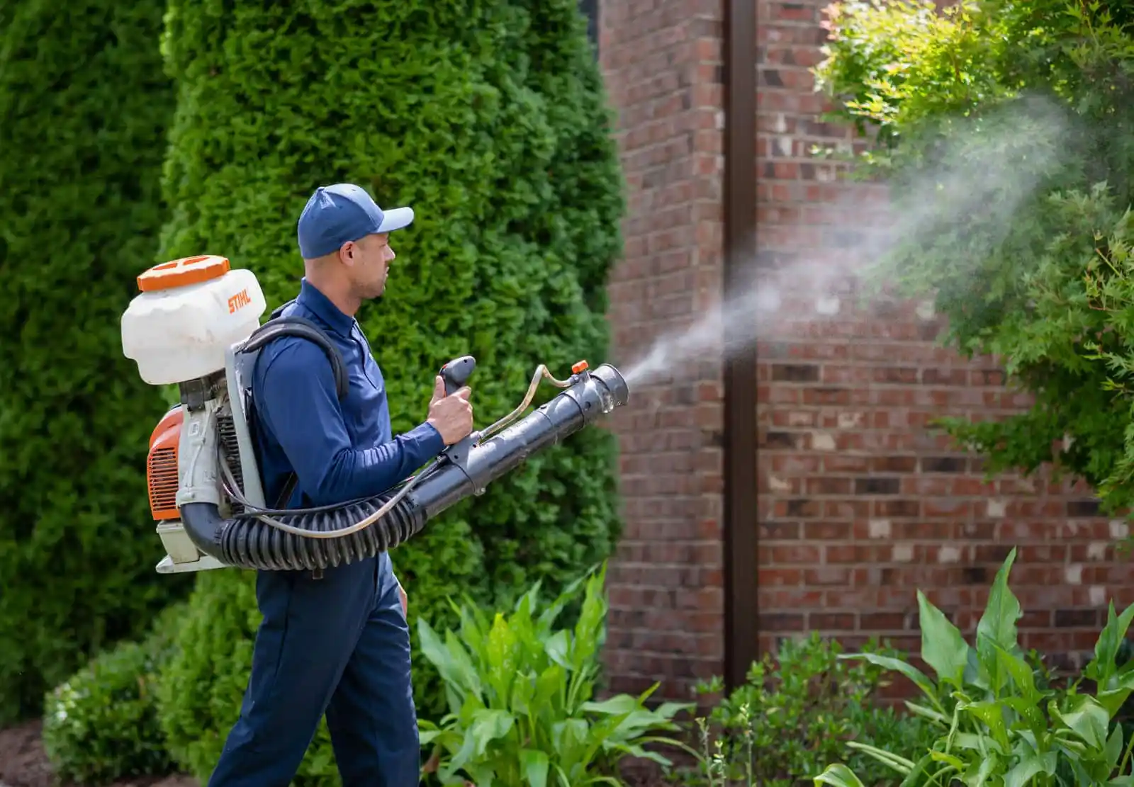 A pest control technician sprays for mosquitoes. Call or contact Rocket Pest Control for mosquito control and spraying in South Carolina.